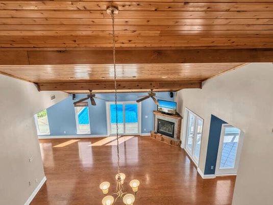 Empty room, Fireplace, Interior, Pendant Lights, Wooden Beams, Wooden Ceilings, Wood Texture Flooring