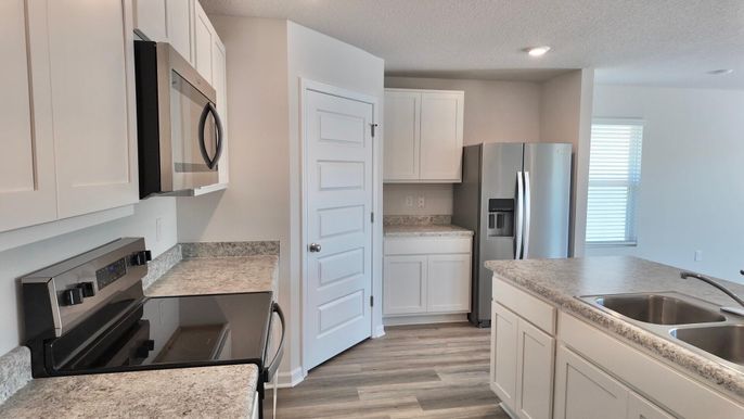 Interior, Kitchen, Recessed Lighting, Stainless Steel Appliances, Wood Texture Flooring