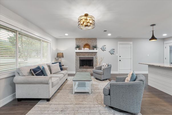 Fireplace, Interior, Living room, Pendant Lights, Recessed Lighting, Stone Walls, Wood Texture Flooring