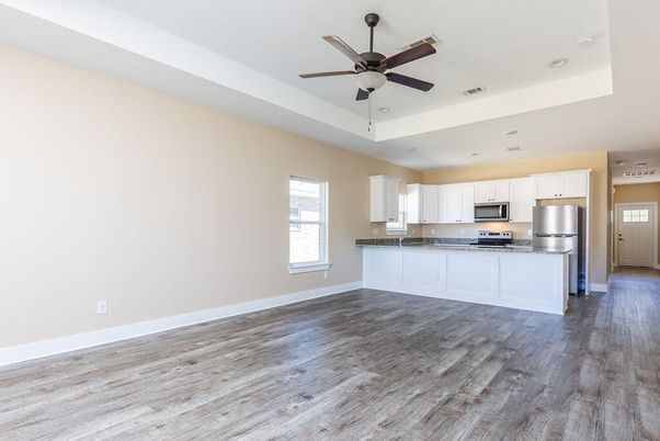 Empty room, Interior, Kitchen, Recessed Lighting, Stainless Steel Appliances, Wood Texture Flooring