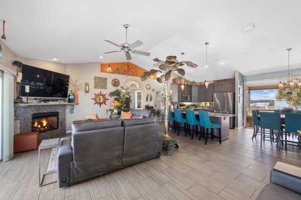 Chandelier, Dining room, Fireplace, Interior, Kitchen, Living room, Pendant Lights, Recessed Lighting, Stainless Steel Appliances, Wood Texture Flooring
