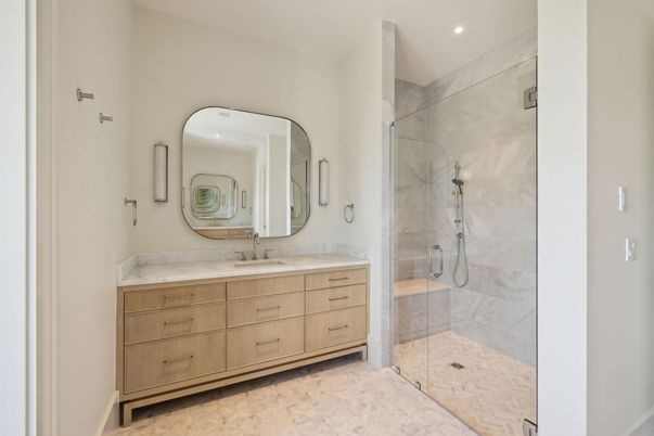 Bathroom, Dual Sink Vanities, Glass Shower, Interior, Marble Walls, Recessed Lighting