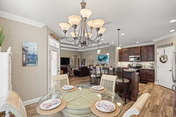 Chandelier, Dining room, Interior, Kitchen, Living room, Pendant Lights, Recessed Lighting, Stainless Steel Appliances, Wood Texture Flooring