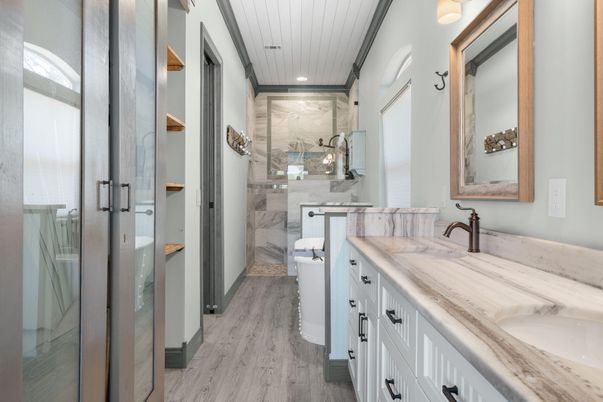 Bathroom, Dual Sink Vanities, Interior, Marble Walls, Recessed Lighting, Wood Texture Flooring