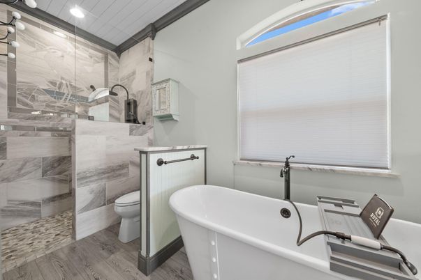 Bathroom, Free Standing Baths, Glass Shower, Interior, Marble Walls, Recessed Lighting, Wood Texture Flooring