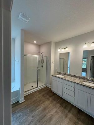 Bathroom, Dual Sink Vanities, Glass Shower, Interior, Recessed Lighting, Wood Texture Flooring