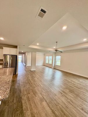 Empty room, Interior, Kitchen, Recessed Lighting, Stainless Steel Appliances, Wood Texture Flooring