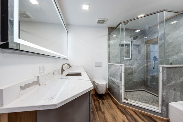 Bathroom, Glass Shower, Interior, Marble Walls, Recessed Lighting, Wood Texture Flooring