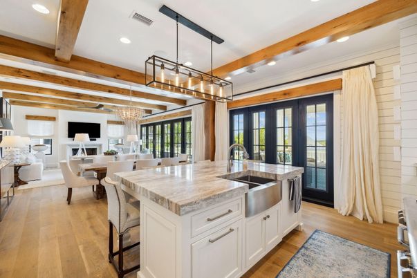 Chandelier, Dining room, Fireplace, Interior, Kitchen, Living room, Pendant Lights, Recessed Lighting, Stainless Steel Appliances, Wooden Beams, Wood Texture Flooring