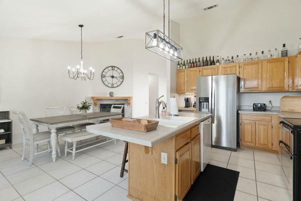 Chandelier, Dining room, Fireplace, Interior, Kitchen, Pendant Lights, Stainless Steel Appliances