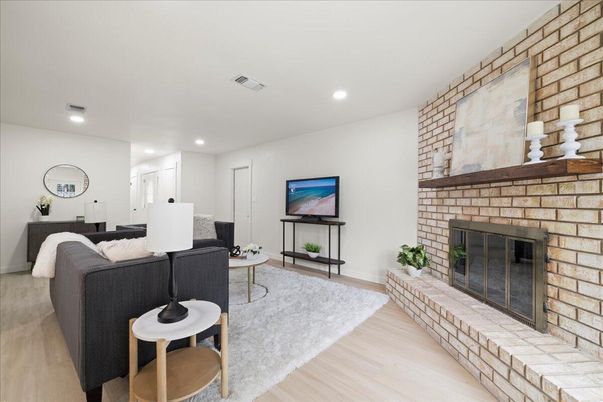 Fireplace, Interior, Living room, Recessed Lighting, Stone Walls, Wood Texture Flooring
