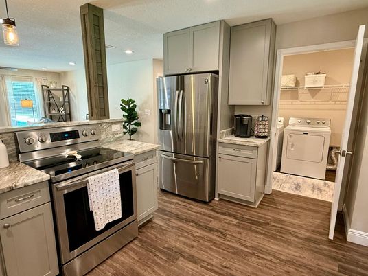 Interior, Kitchen, Recessed Lighting, Stainless Steel Appliances, Washer, Wood Texture Flooring