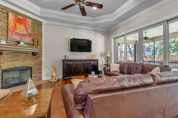 Fireplace, Interior, Living room, Recessed Lighting, Stone Walls, Wood Texture Flooring