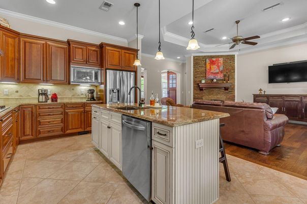 Interior, Kitchen, Living room, Pendant Lights, Recessed Lighting, Stainless Steel Appliances, Stone Walls, Wood Texture Flooring