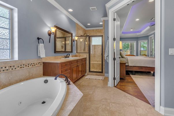 Bathroom, Bedroom, Dual Sink Vanities, Glass Shower, Interior, Recessed Lighting, Wood Texture Flooring