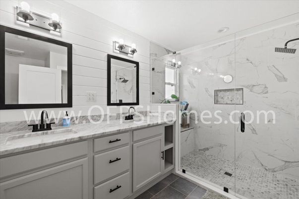Bathroom, Dual Sink Vanities, Glass Shower, Interior, Marble Walls, Recessed Lighting