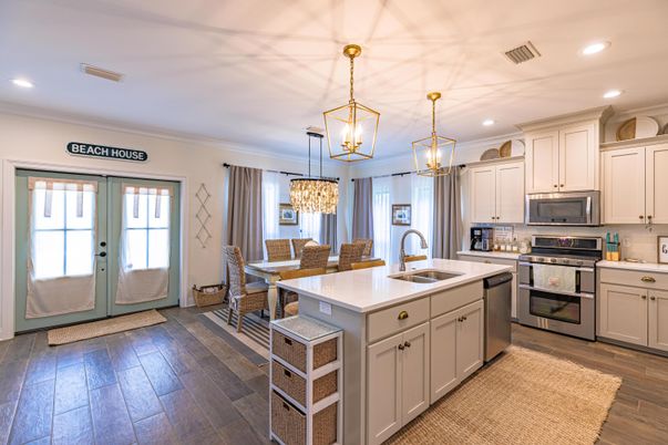 Chandelier, Dining room, Interior, Kitchen, Pendant Lights, Recessed Lighting, Stainless Steel Appliances, Wood Texture Flooring