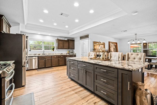 Dining room, Interior, Kitchen, Pendant Lights, Recessed Lighting, Stainless Steel Appliances, Wood Texture Flooring