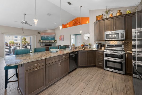 Fireplace, Interior, Kitchen, Pendant Lights, Recessed Lighting, Stainless Steel Appliances, Wood Texture Flooring