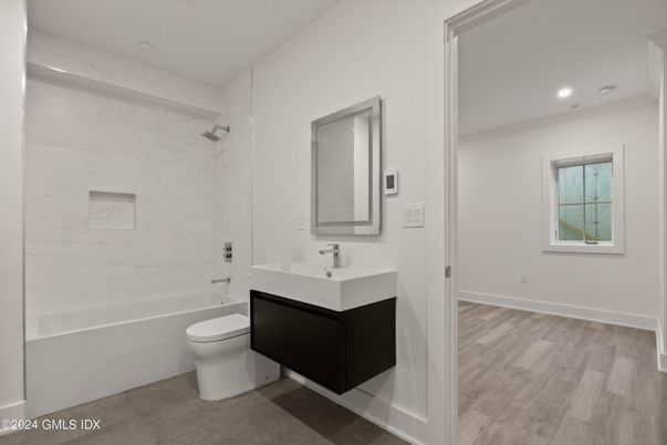 Bathroom, Interior, Marble Walls, Recessed Lighting, Wood Texture Flooring