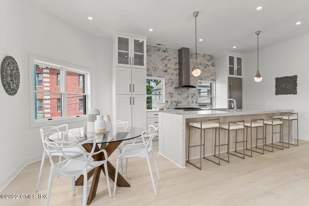 Dining room, Interior, Kitchen, Pendant Lights, Recessed Lighting, Stainless Steel Appliances, Stone Walls, Wood Texture Flooring