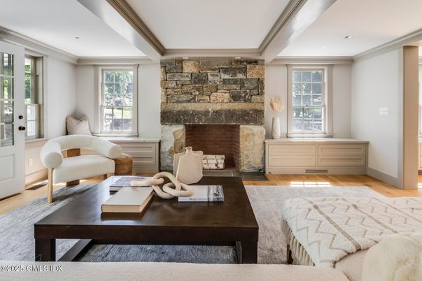 Fireplace, Interior, Living room, Recessed Lighting, Stone Walls, Wood Texture Flooring