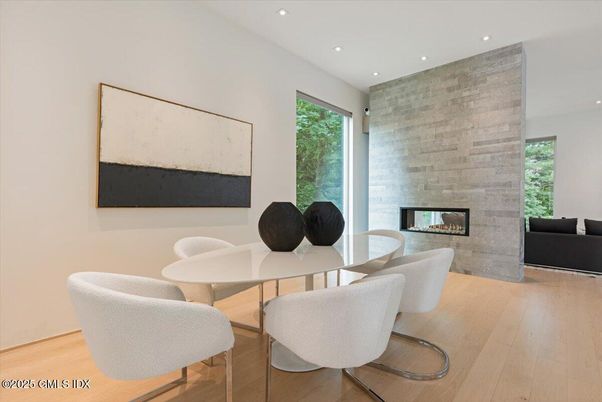 Dining room, Fireplace, Interior, Recessed Lighting, Stone Walls, Wood Texture Flooring