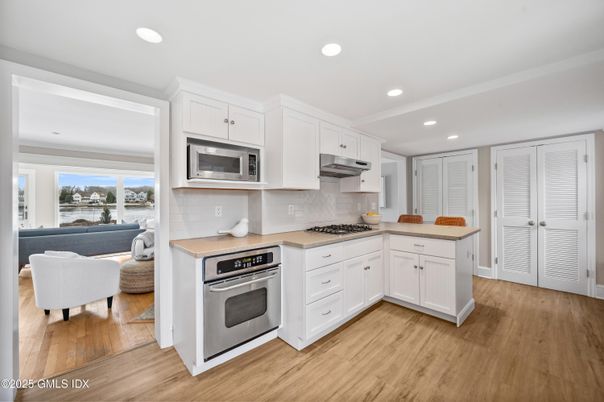 Interior, Kitchen, Living room, Recessed Lighting, Stainless Steel Appliances, Water, Wood Texture Flooring