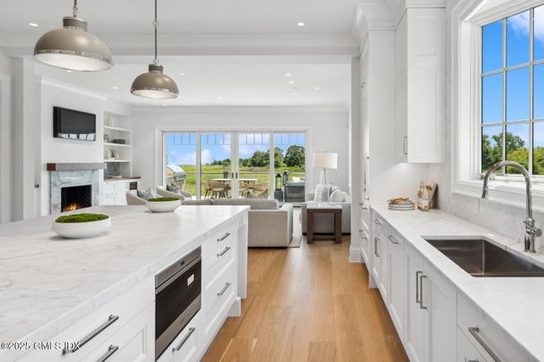 Fireplace, Interior, Kitchen, Living room, Pendant Lights, Recessed Lighting, Wood Texture Flooring