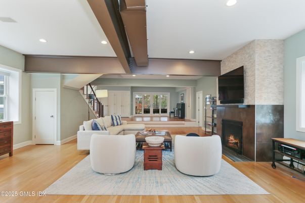 Fireplace, Interior, Living room, Recessed Lighting, Stone Walls, Wood Texture Flooring