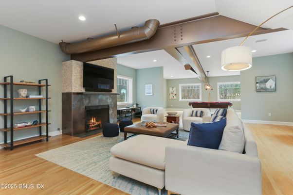Billiard Table, Fireplace, Game Room, Interior, Living room, Pendant Lights, Recessed Lighting, Wood Texture Flooring