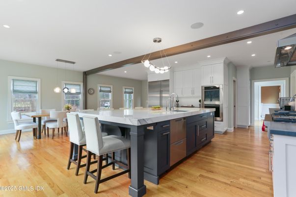 Dining room, Interior, Kitchen, Pendant Lights, Recessed Lighting, Stainless Steel Appliances, Wooden Beams, Wood Texture Flooring