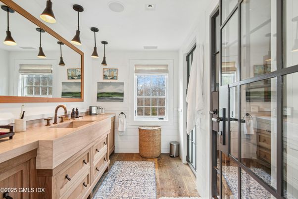 Bathroom, Dual Sink Vanities, Glass Shower, Interior, Pendant Lights, Wood Texture Flooring