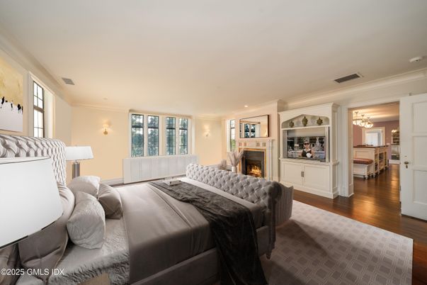Bedroom, Chandelier, Fireplace, Interior, Recessed Lighting, Wood Texture Flooring