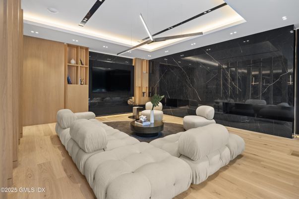 Fireplace, Interior, Living room, Marble Walls, Recessed Lighting, Wood Texture Flooring