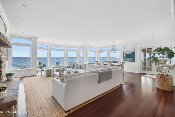 Dining room, Fireplace, Interior, Living room, Pendant Lights, Recessed Lighting, Water, Wood Texture Flooring