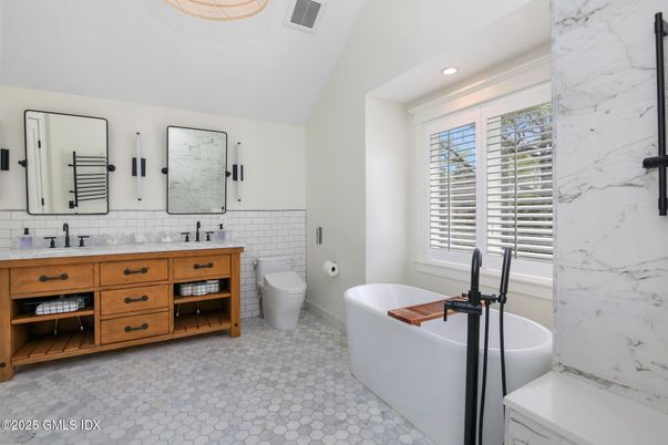 Bathroom, Dual Sink Vanities, Free Standing Baths, Interior, Marble Walls, Recessed Lighting