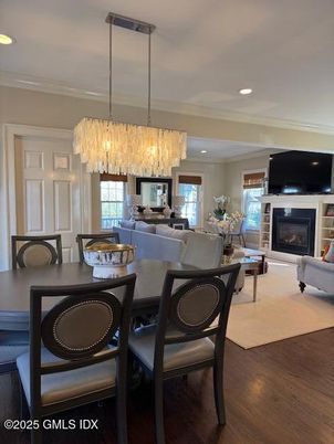 Chandelier, Dining room, Fireplace, Interior, Living room, Recessed Lighting, Wood Texture Flooring