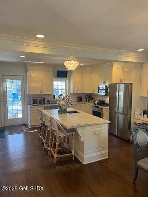 Chandelier, Interior, Kitchen, Recessed Lighting, Stainless Steel Appliances, Wood Texture Flooring
