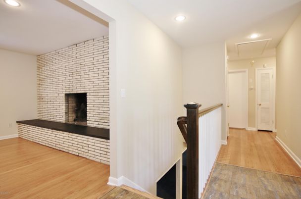 Fireplace, Interior, Recessed Lighting, Stone Walls, Wood Texture Flooring