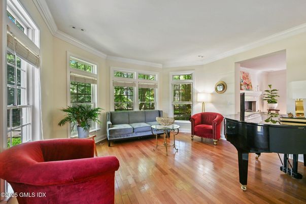 Fireplace, Interior, Living room, Piano, Recessed Lighting, Wood Texture Flooring