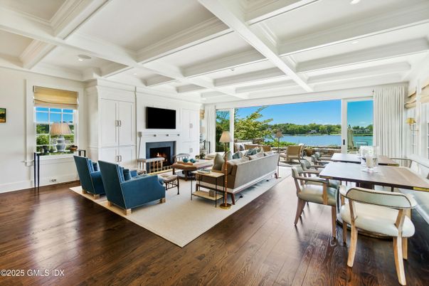 Dining room, Fireplace, Interior, Living room, Recessed Lighting, Water, Wood Texture Flooring