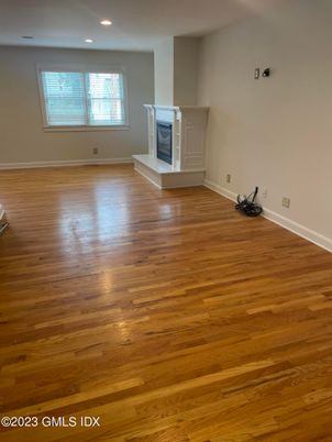 Empty room, Fireplace, Interior, Recessed Lighting, Wood Texture Flooring