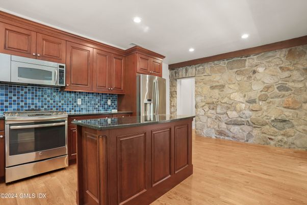 Interior, Kitchen, Recessed Lighting, Stainless Steel Appliances, Stone Walls, Wood Texture Flooring
