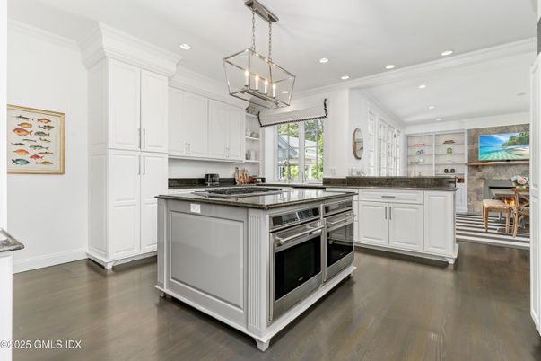 Interior, Kitchen, Pendant Lights, Recessed Lighting, Stainless Steel Appliances, Stone Walls, Wood Texture Flooring