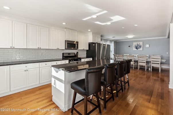 Dining room, Interior, Kitchen, Recessed Lighting, Stainless Steel Appliances, Wood Texture Flooring