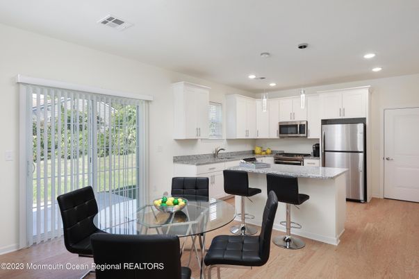 Dining room, Interior, Kitchen, Pendant Lights, Recessed Lighting, Stainless Steel Appliances, Wood Texture Flooring