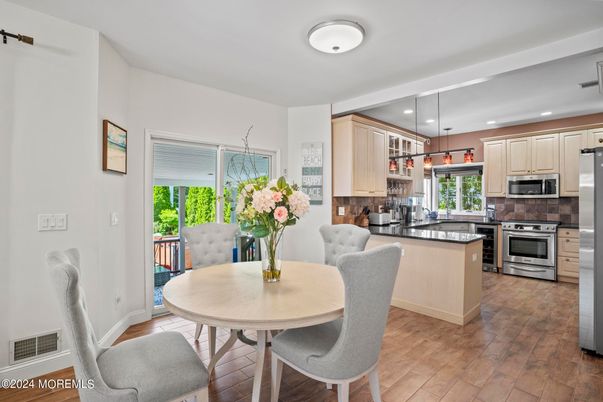 Dining room, Interior, Kitchen, Pendant Lights, Recessed Lighting, Stainless Steel Appliances, Wood Texture Flooring