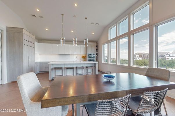 Dining room, Interior, Kitchen, Pendant Lights, Recessed Lighting, Stainless Steel Appliances, Wood Texture Flooring