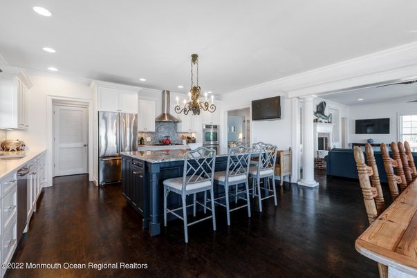 Chandelier, Dining room, Interior, Kitchen, Recessed Lighting, Stainless Steel Appliances, Wood Texture Flooring